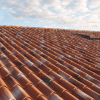 Pannelli metallici di copertura stampati a forma di coppo. Isocoppo-Tek28-Alutech Dach